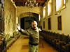 Felix Ortiz is standing in the room where we enjoyed afternoon coffee (note 15th century Flemish tapestry) (66,545 bytes)